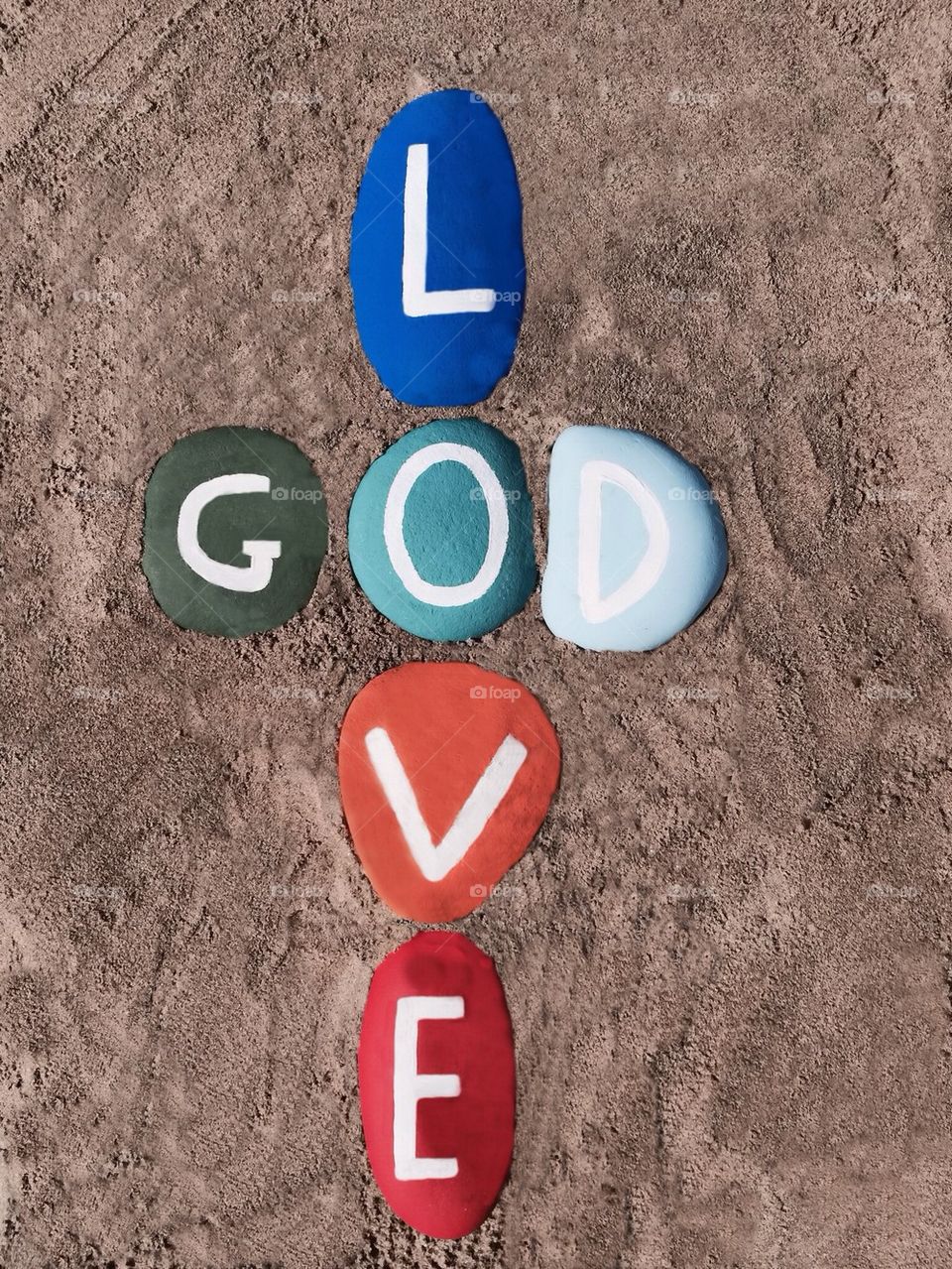 God is love, multicolored stones composition