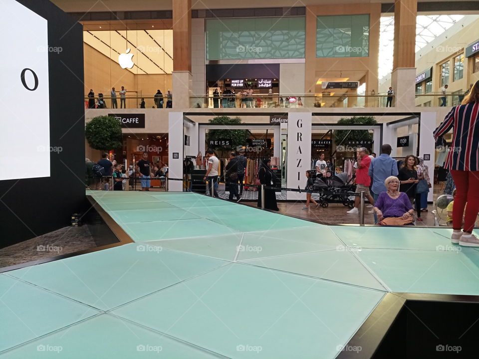 People moving around in a mall