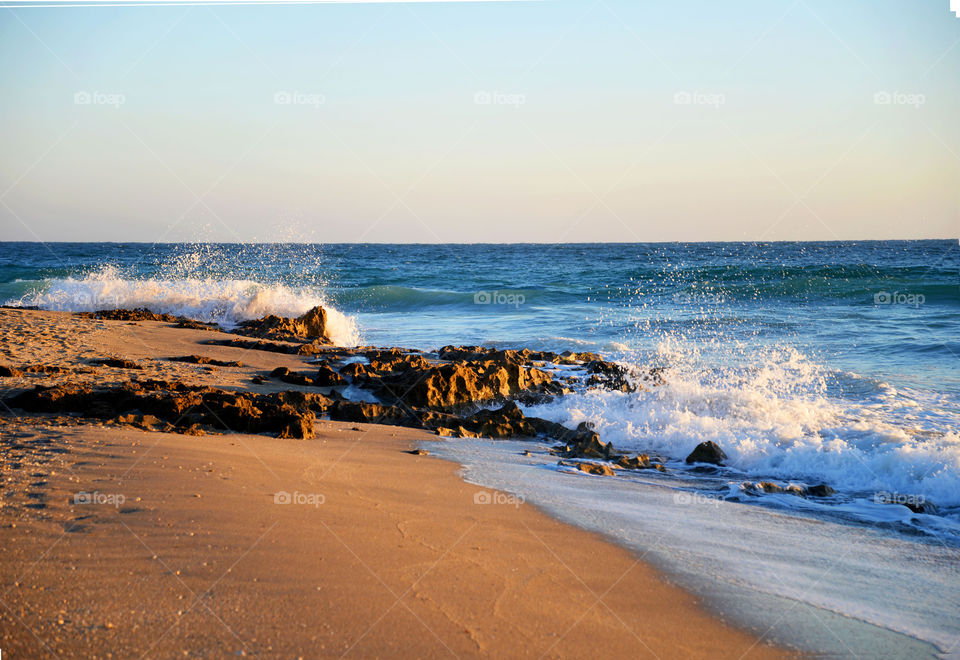 Waves crashing on rocks at beach