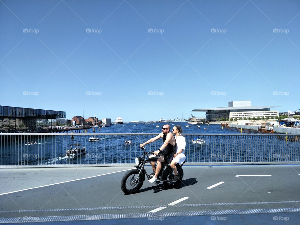 drive a motorcycle way on the bridge in summer Copenhagen Denmark