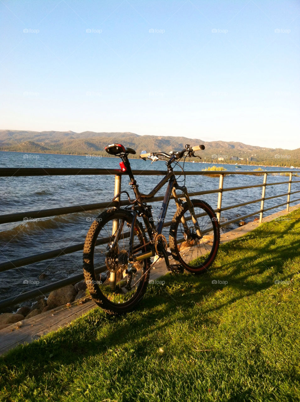grass fence sunset bike by jjsobol