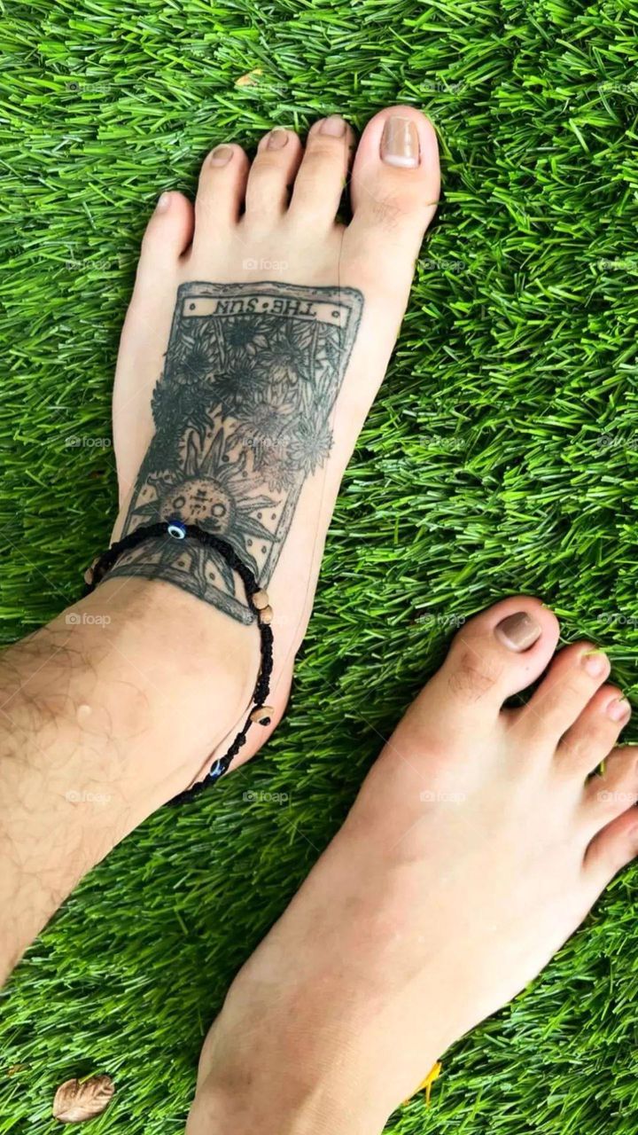 It's yours to take 
Feet on the grass