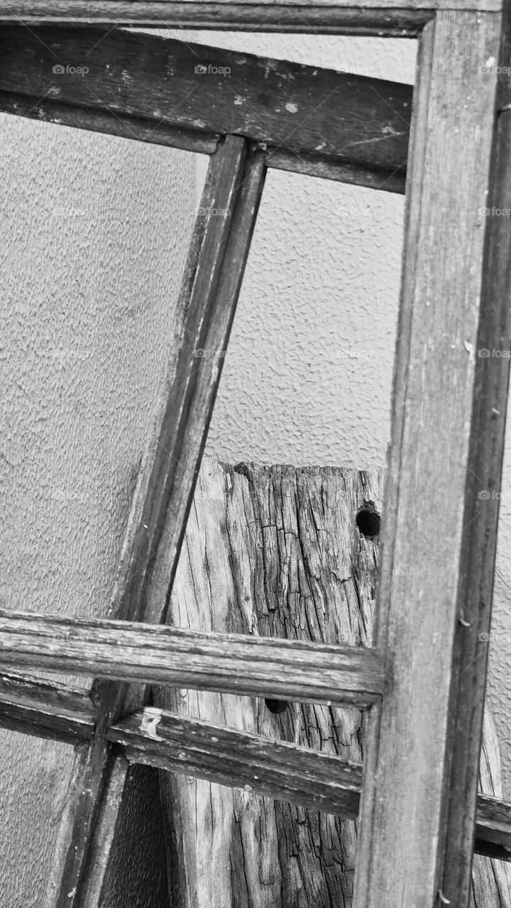 black and white image of wooden window frames.