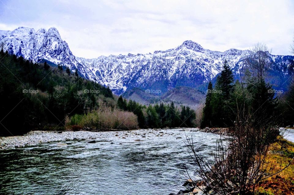 beautiful river with snowcapped mountain background