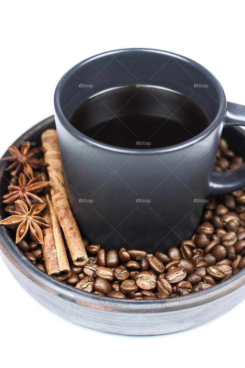 cup of black coffee with cinnamon and anise