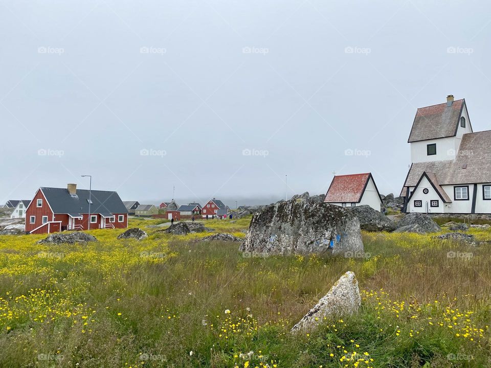 A church and houses in a small village in Greenland 