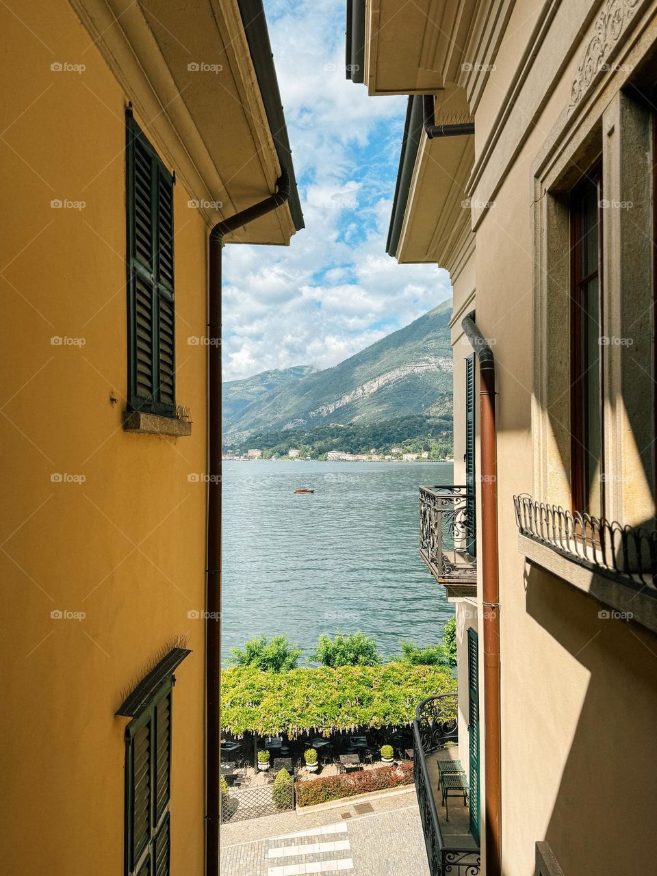 Incredible view from the hotel of a boat touring the lake with the mountains in the background