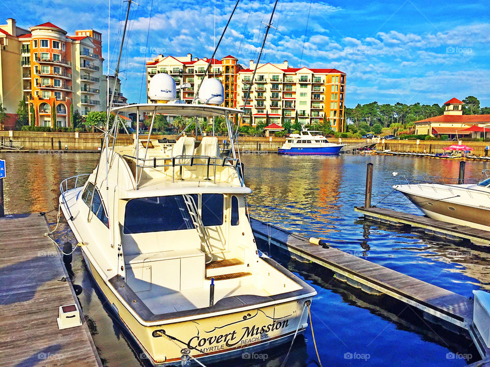 A boat docked in a marina. 