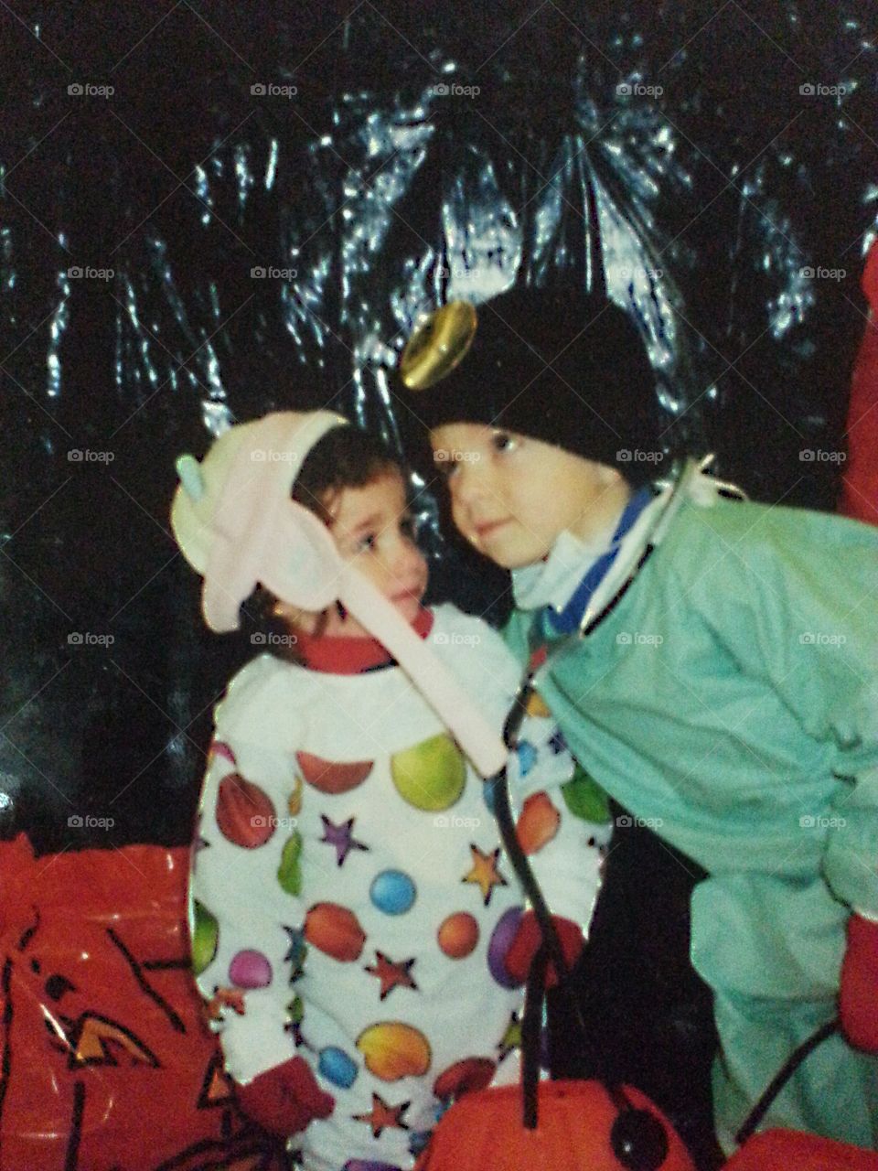 Two adorable kids looking away