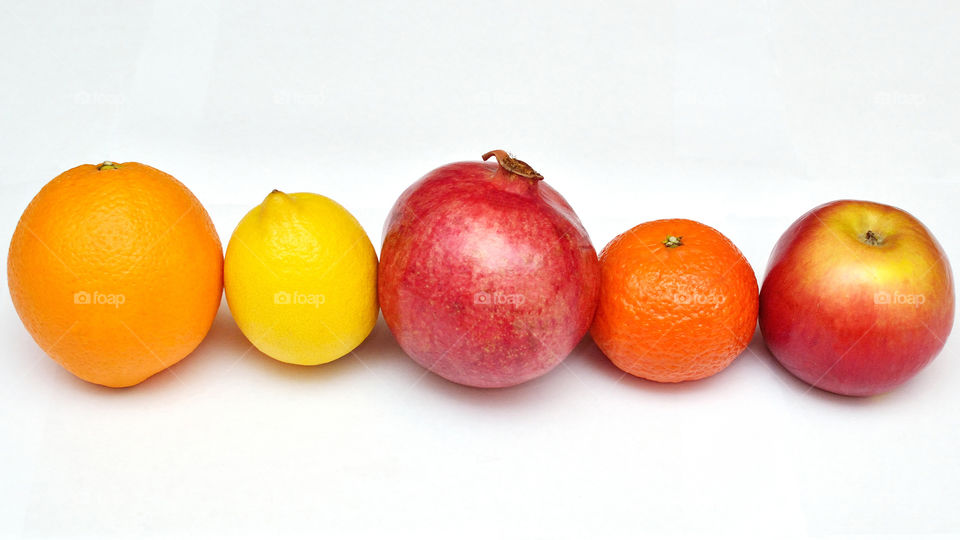 Variety of fruits on white background