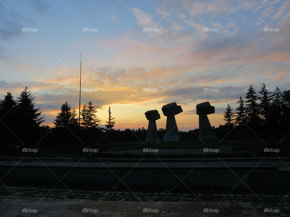 Sunset over the monument against represion