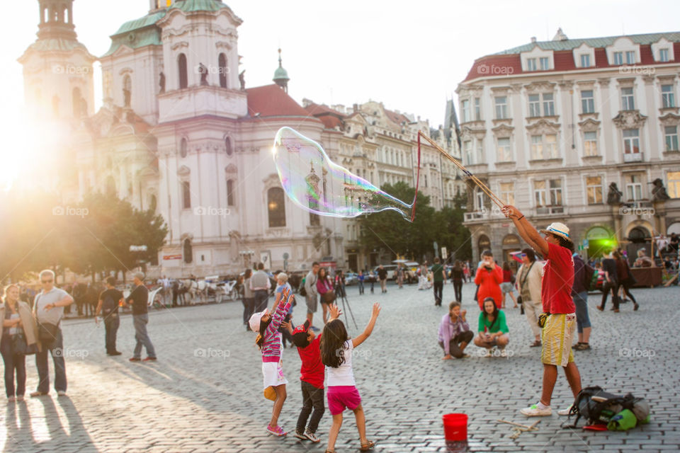 Kids chasing bubbles 