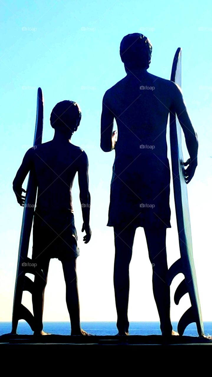 father and son surfing