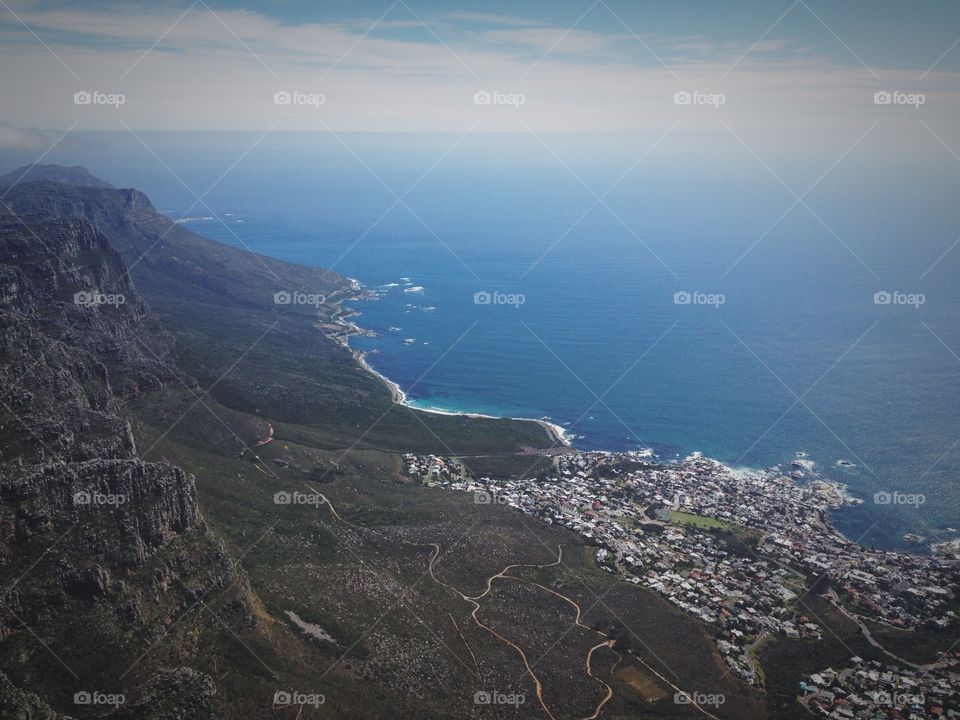 Table Mountain is a flat-topped mountain forming a prominent landmark overlooking the city of Cape Town in South Africa. 