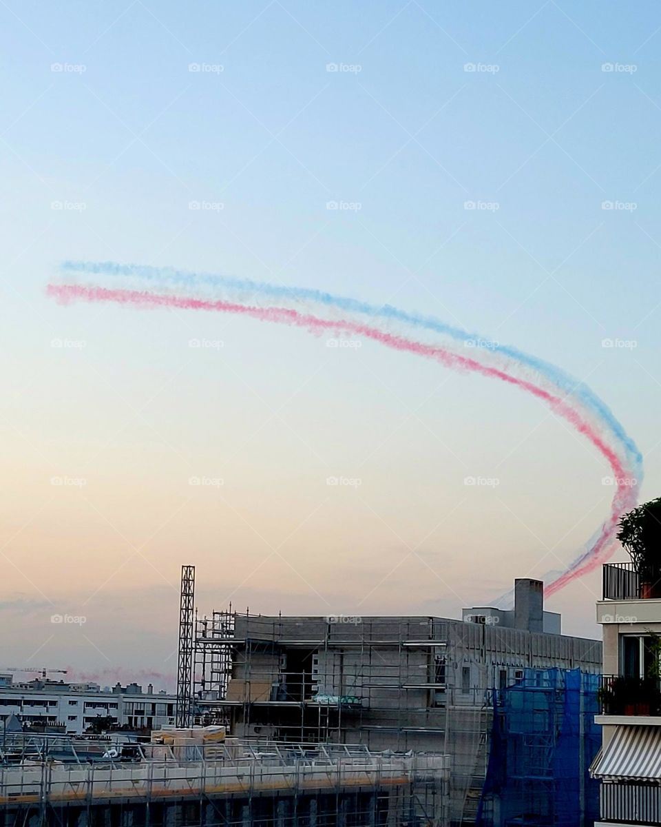 French flag colors in evening sky as planes passed to celebrate.