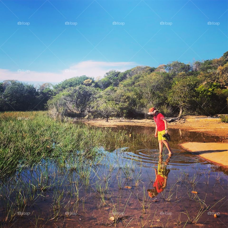 Reflections in the pond looking for tadpoles 