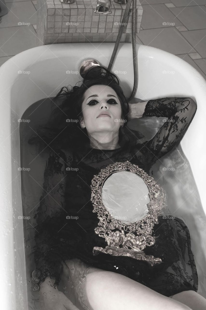 Woman and magic mirror , take bath