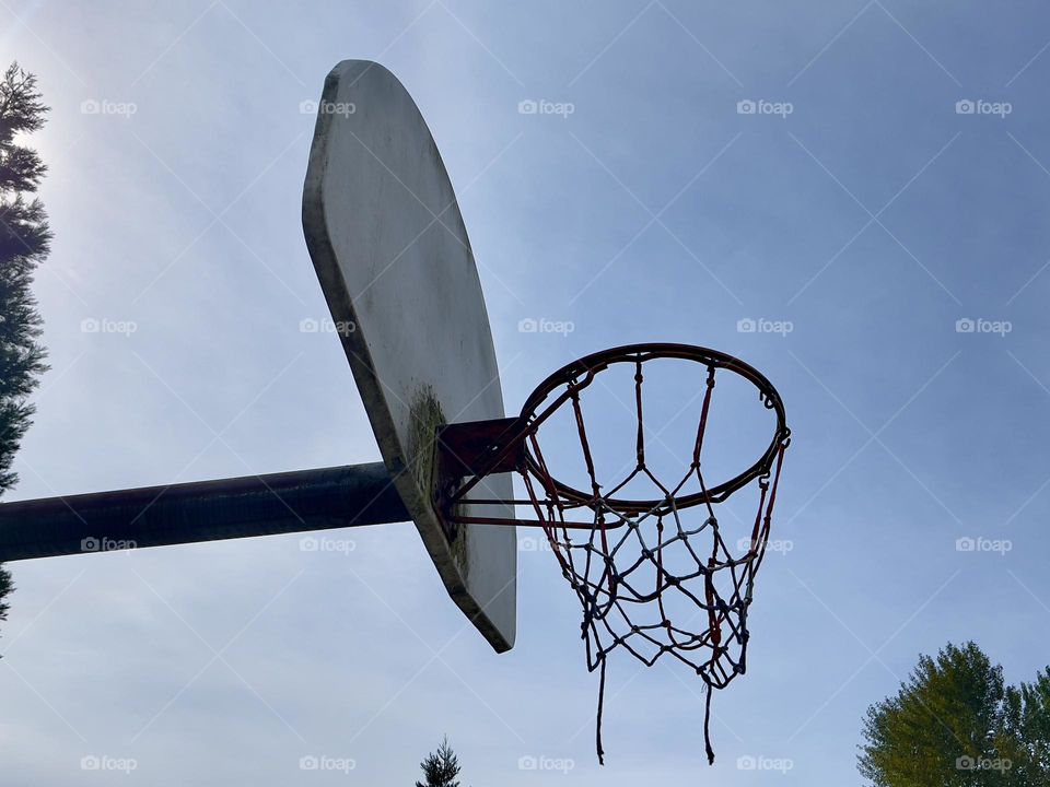 Basketball hoop on the blue sky background 