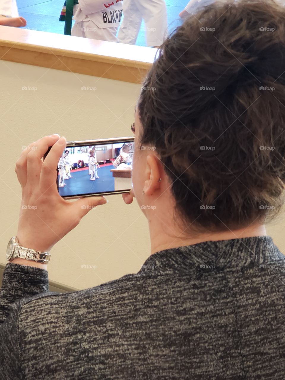 lady recording with phone