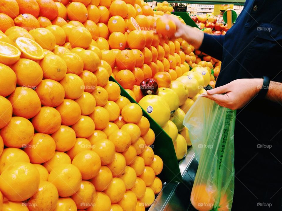 Man buying oranges