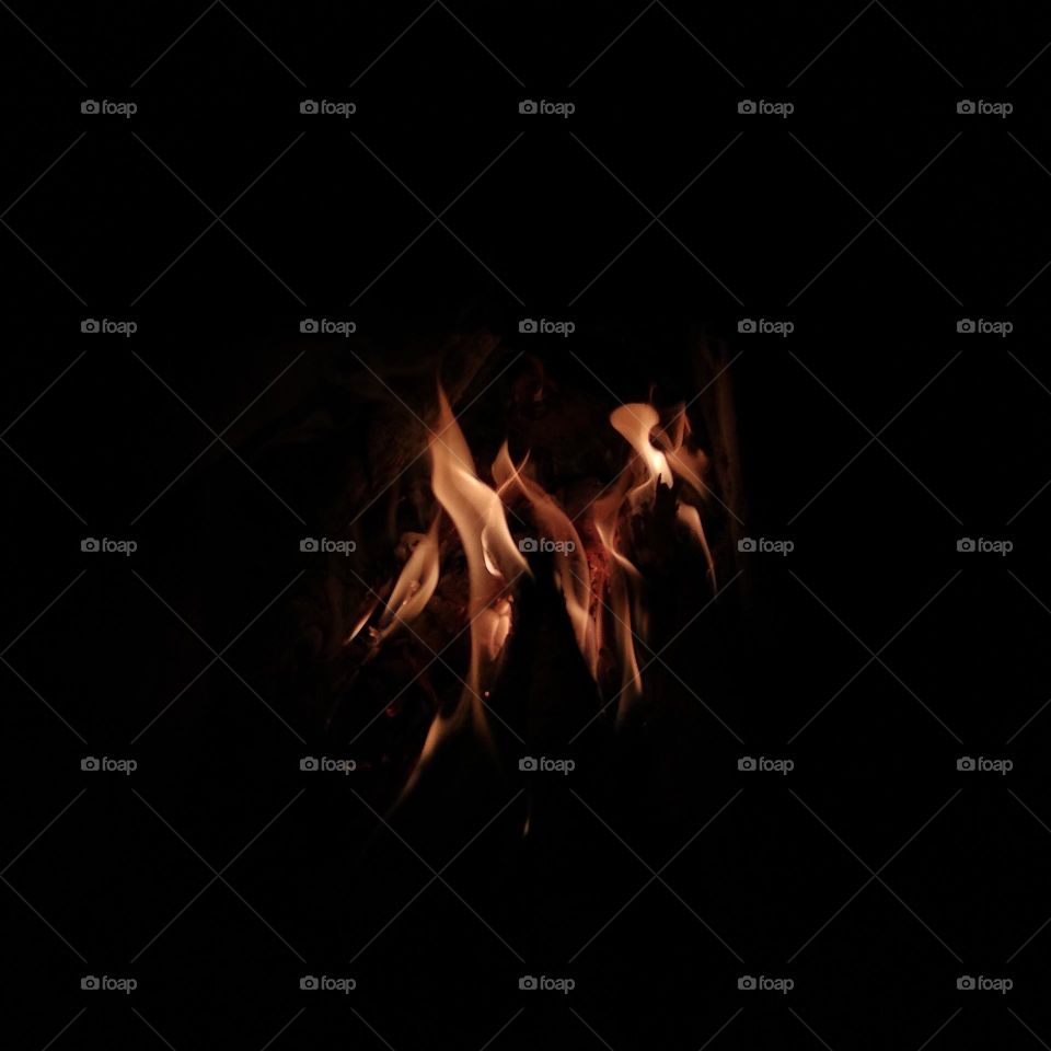 Photo of a burning and smoldering fire.