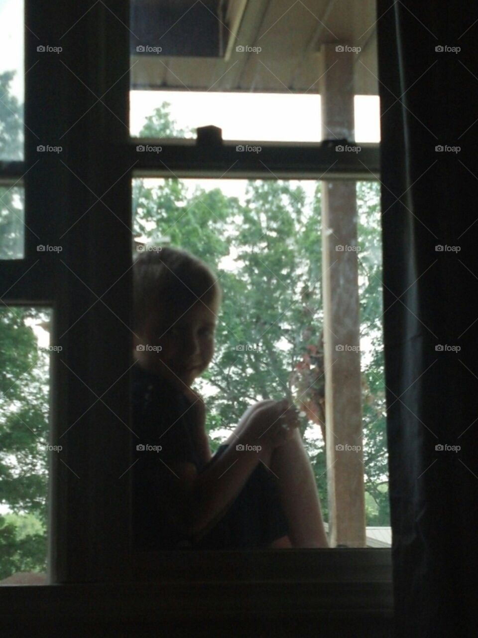 picture perfect portrait. my 6 year old son climbs in window waiting on me to cone out and play