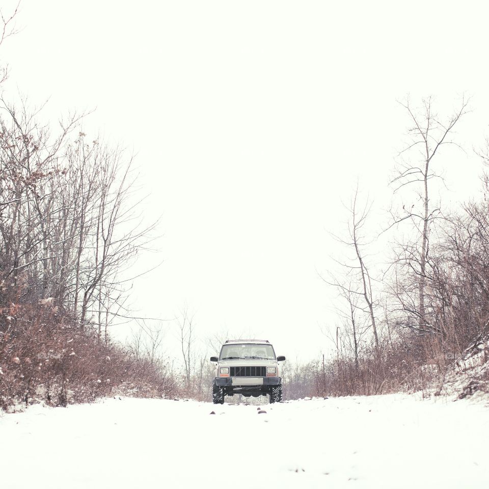 A Jeep on a snow road.
