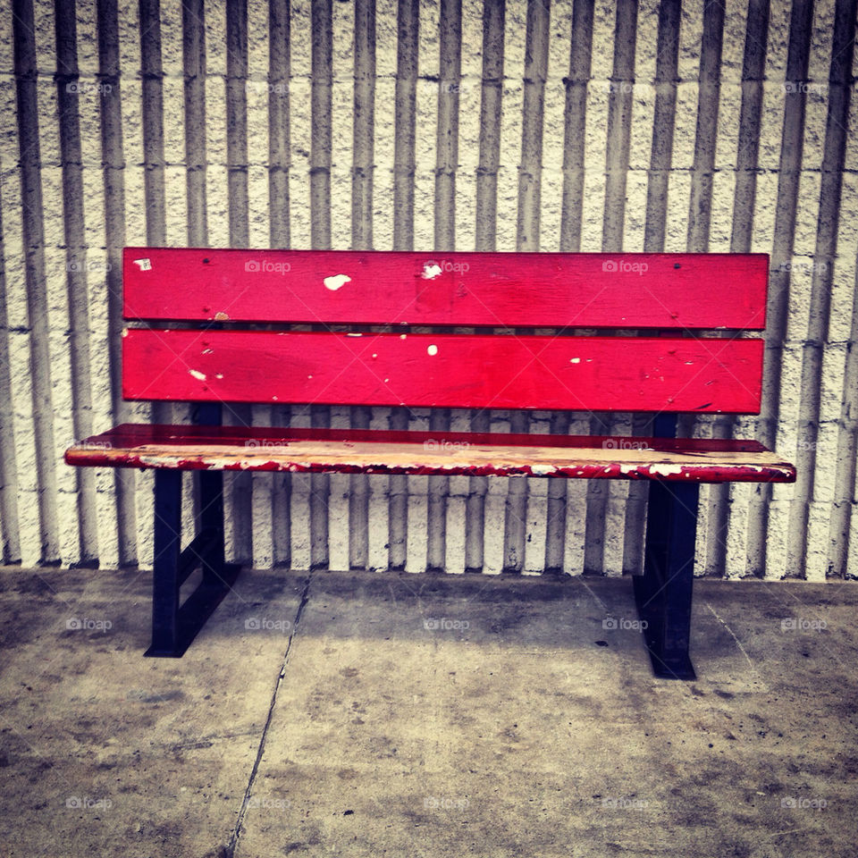chipped red bench.