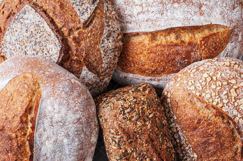 Selection of freshly baked organic sourdough loafs of bread.