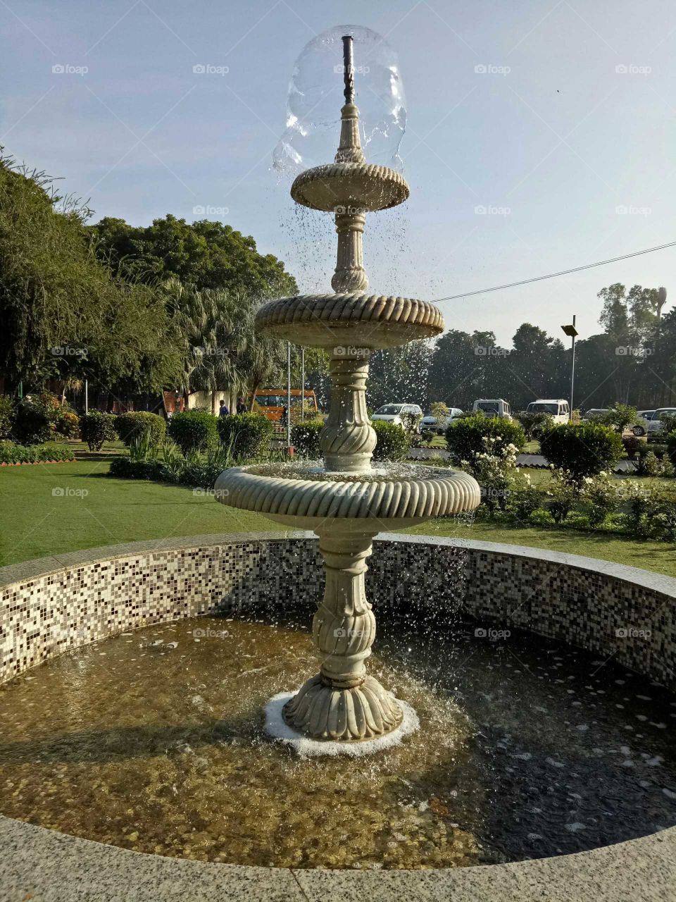 Water fountain in sunny morning at college garden