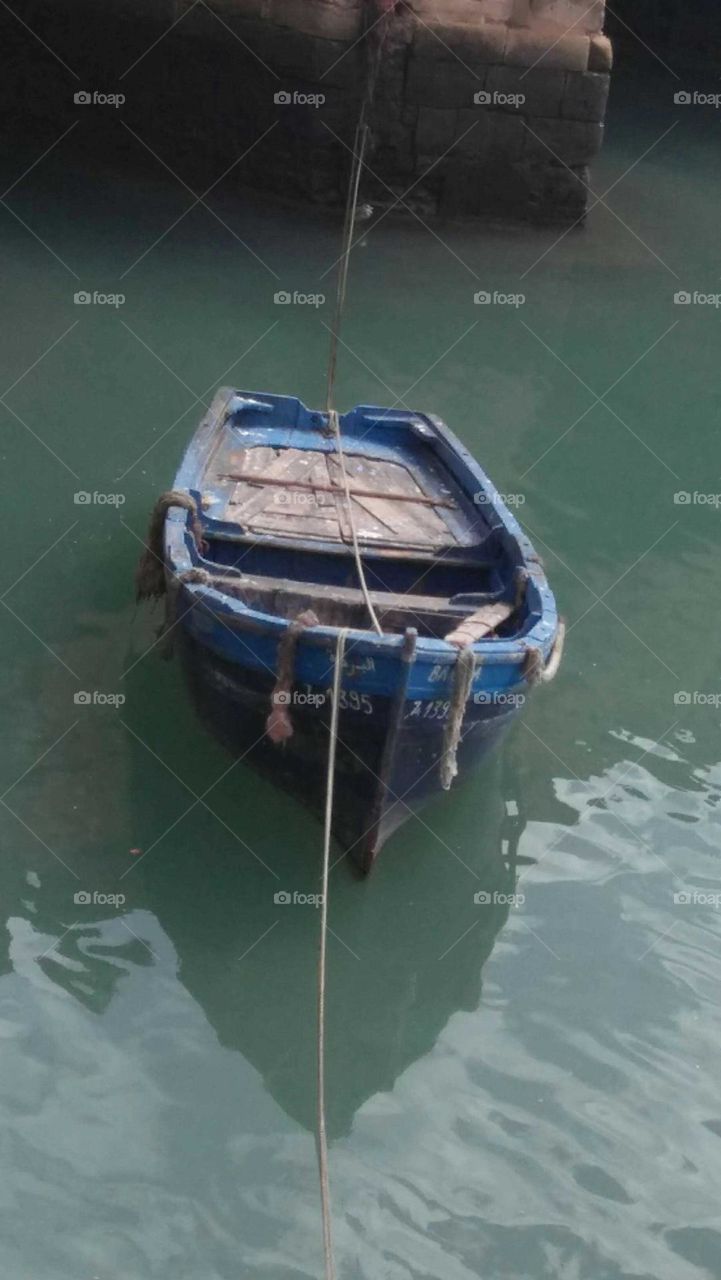 Beautiful blue boat in harbour at essaouira city in Morocco.