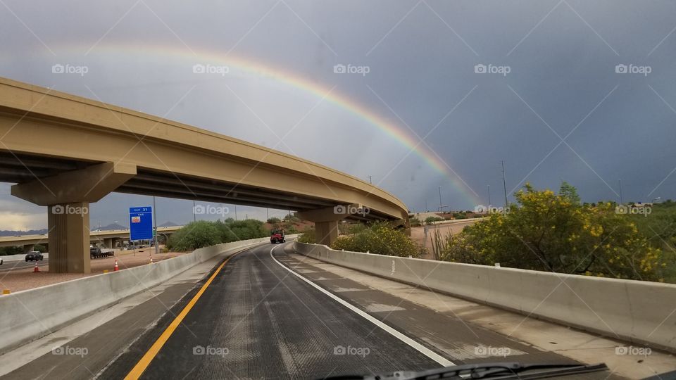 Rainbow over a bridge