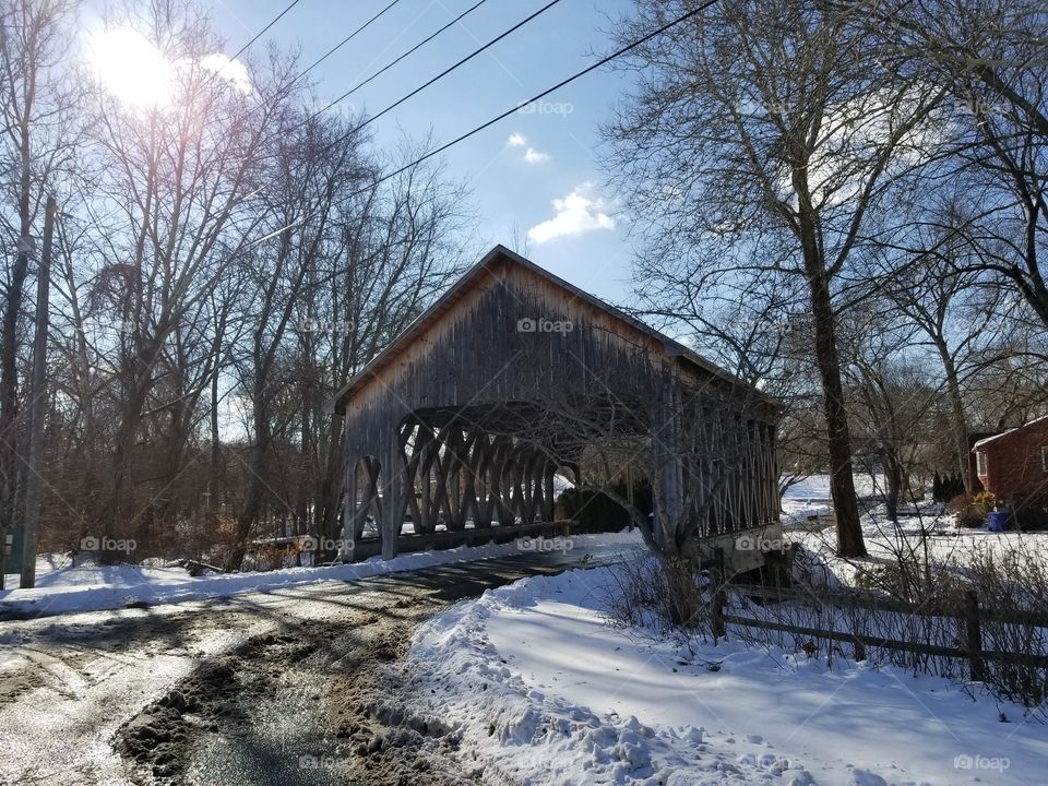 covered bridge in the snow