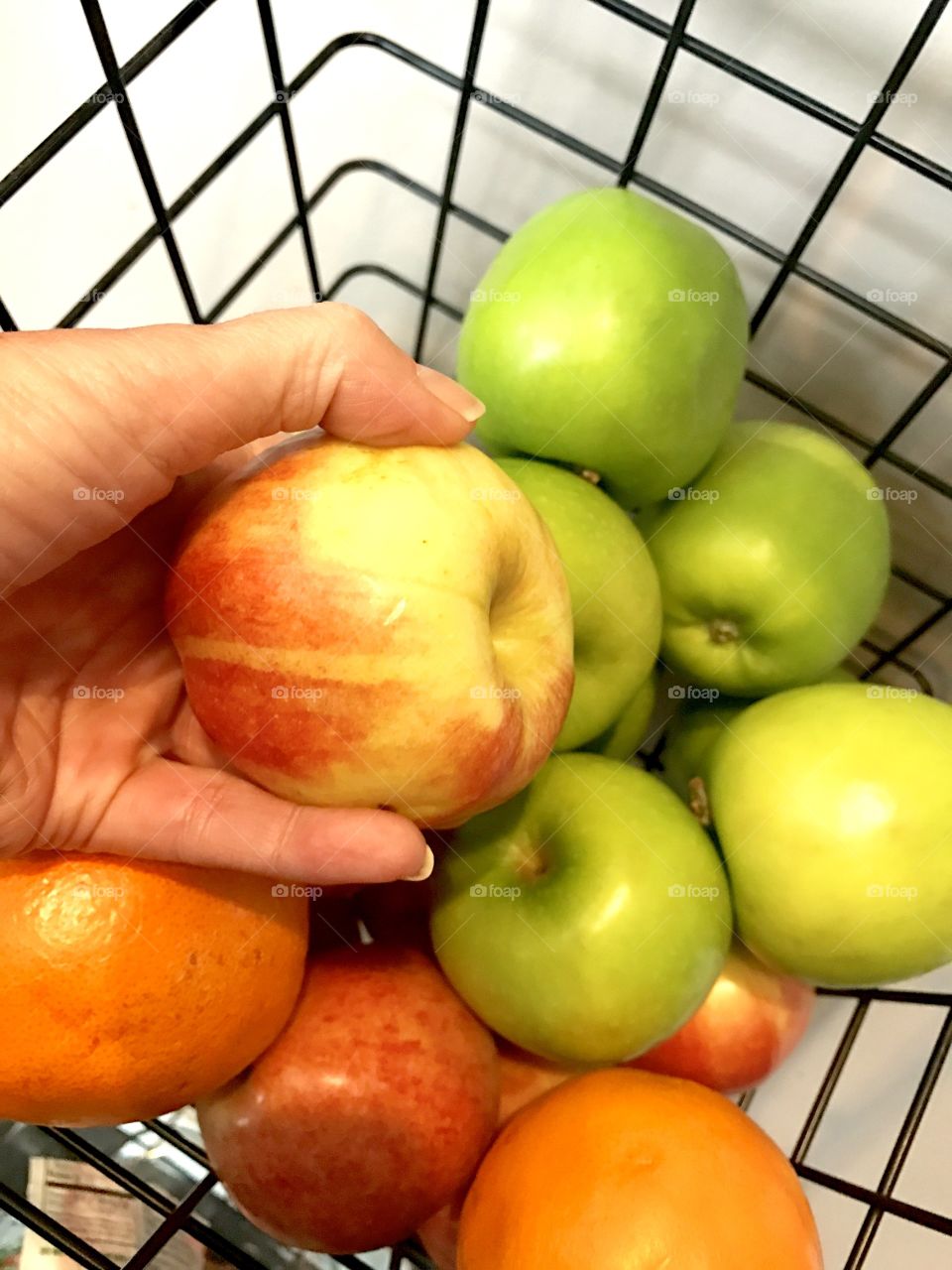 Hand in Fruit Basket