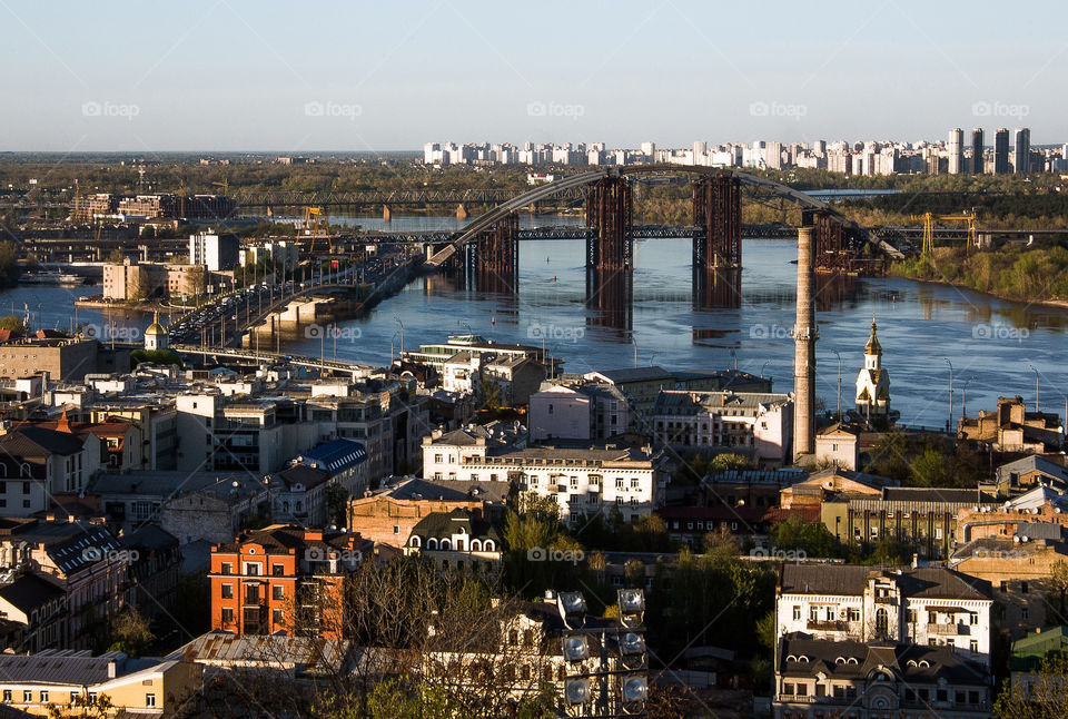 beautiful view of the city measured by the golden rays of the bright sun from a great height