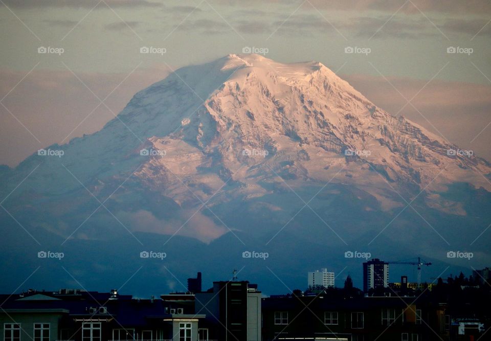 Mount Rainier Stands watch over Tacoma, Washington, it’s snowy coat heavy in the winter months