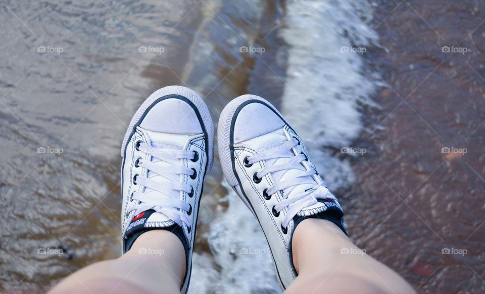 feets of the girl in the beach