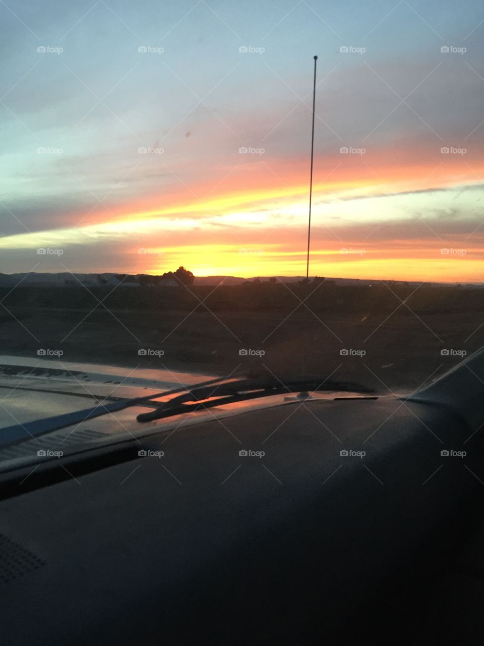 Sunset over old car dashboard