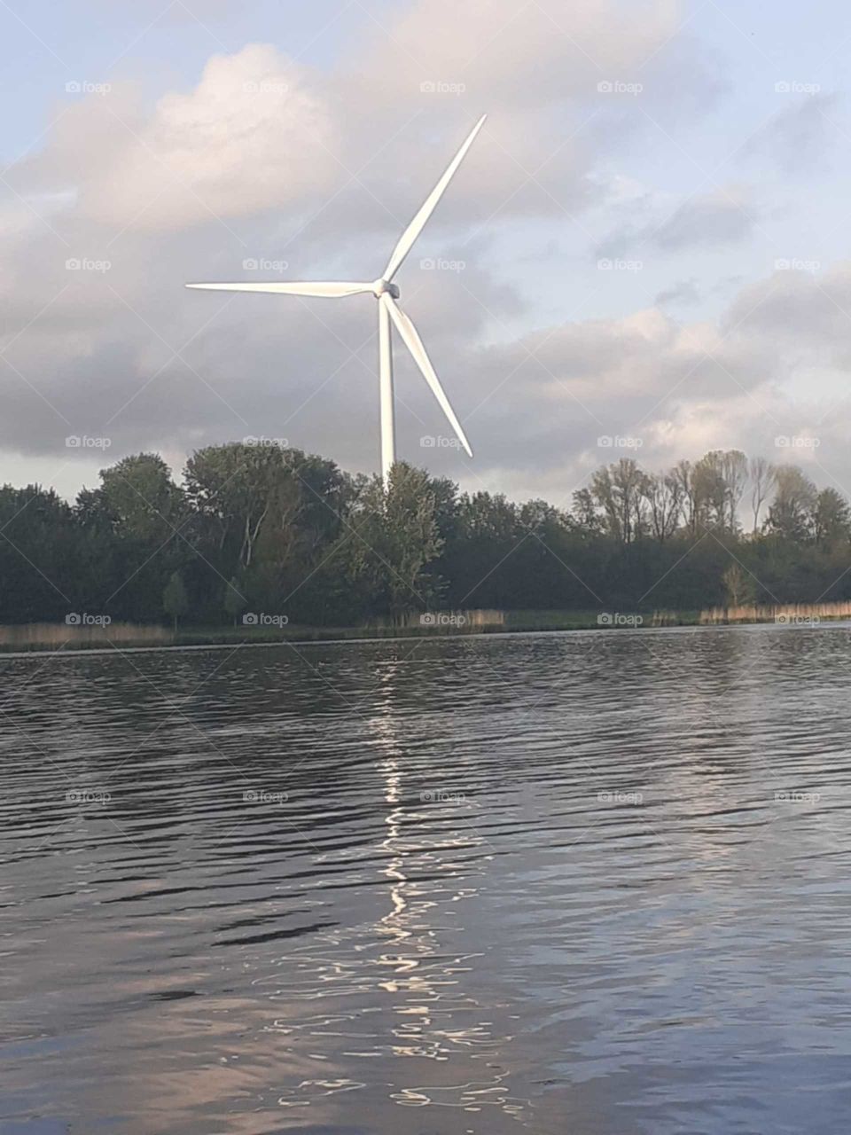 windmill along the lake the netherlands