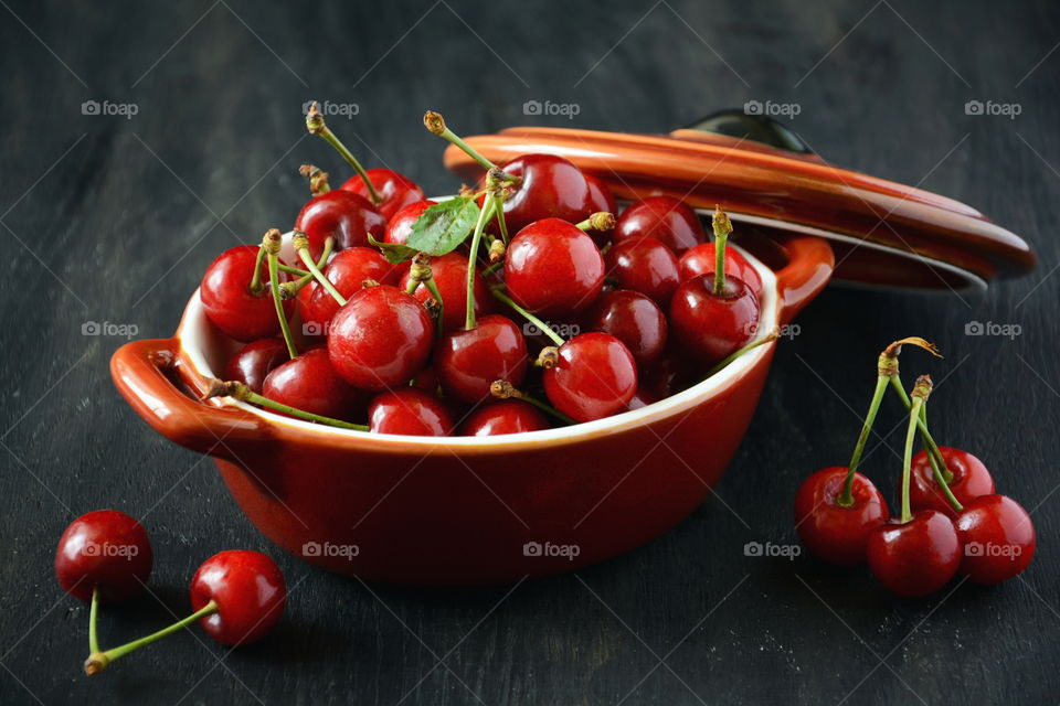 Ripe cherries on dark background. Ripe cherries on dark background