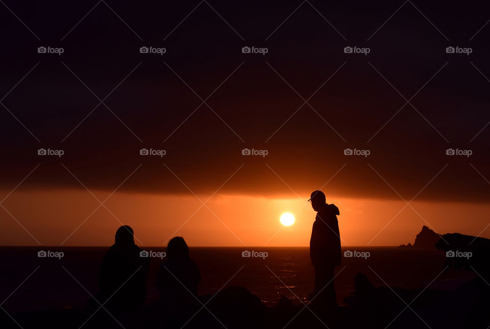 People watching the sunset on the beach 