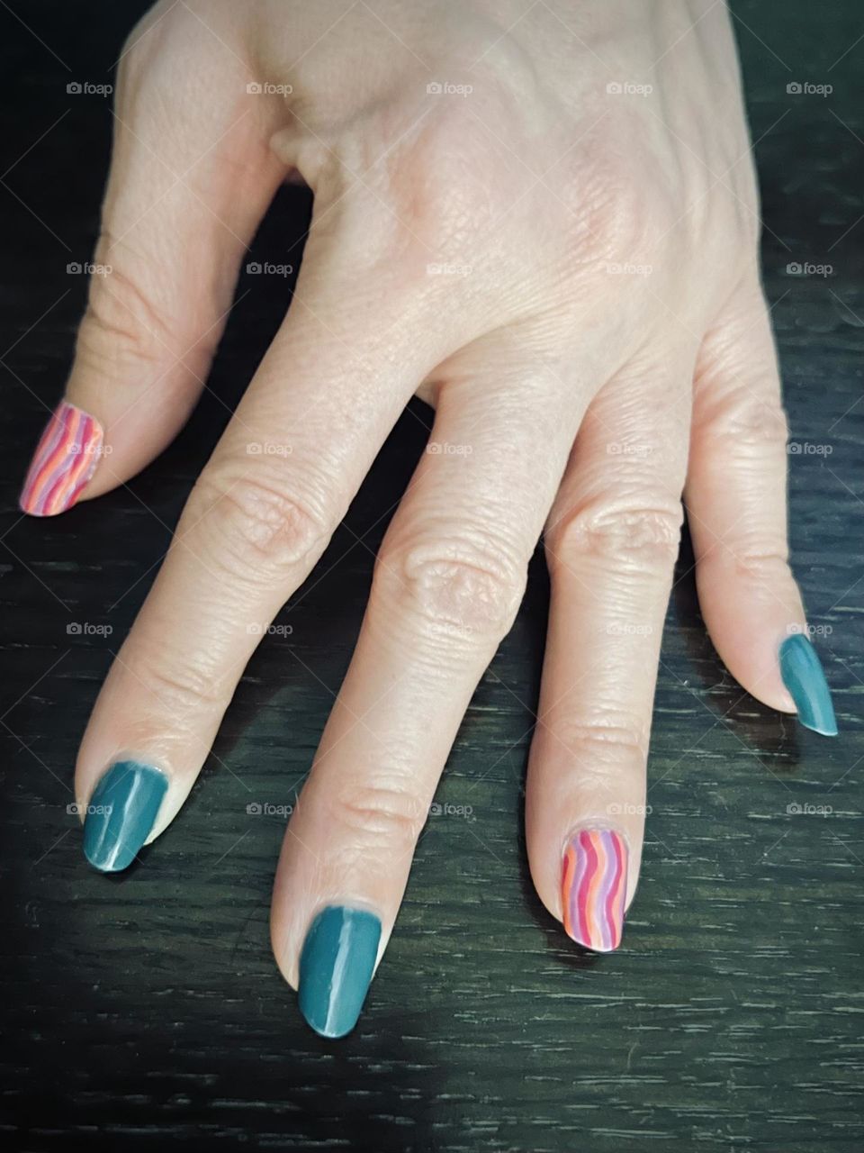 Teal and pink gel nail polish manicure 