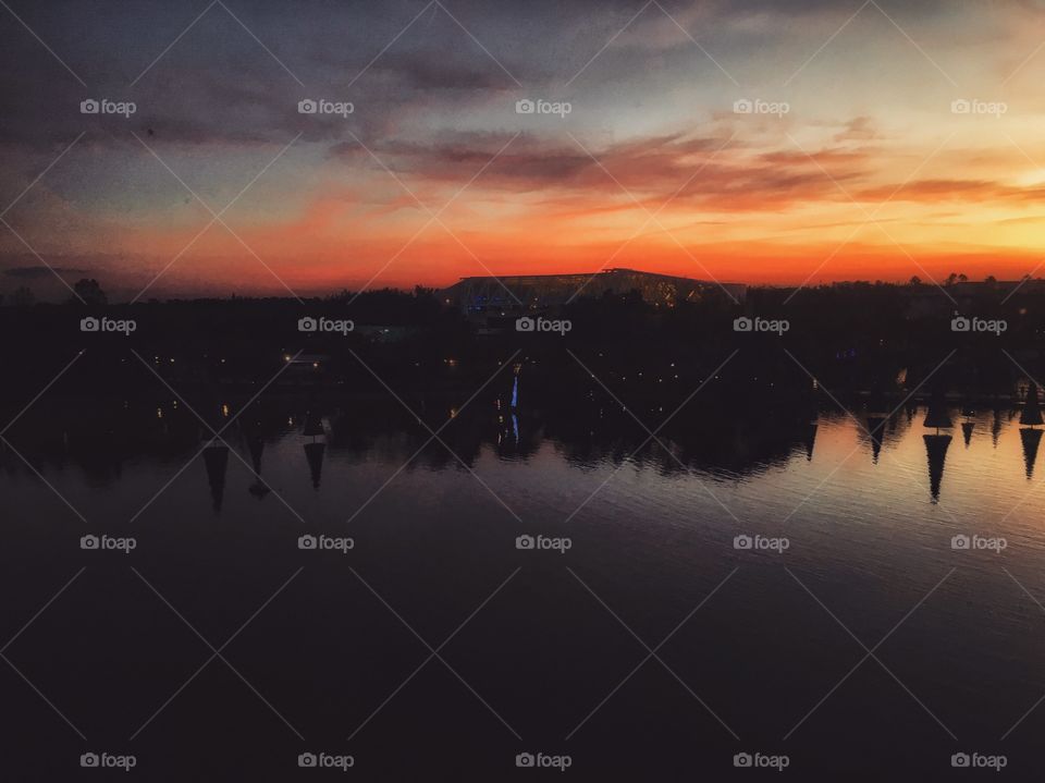 Watching the sun go down while the sky lights up with fire 