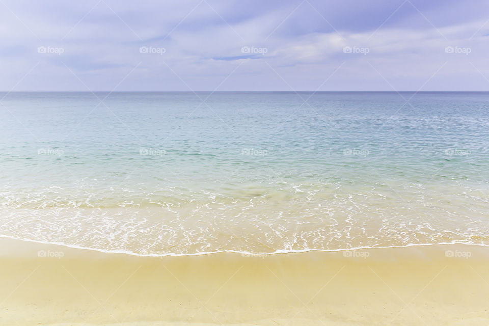 Beach and tropical sea with soft wave on sandy beach