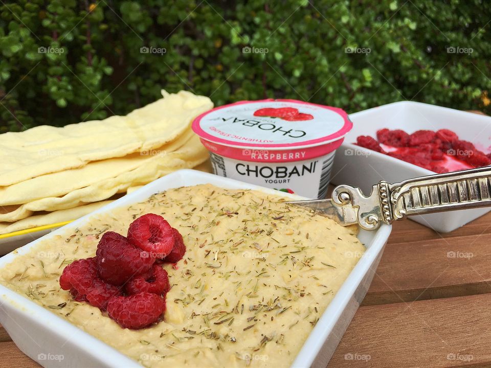 Scarborough Fair Chobani Raspberry Yogurt Hummus dip and spread. INGREDIENTS  include Parsley, Sage, Raspberries (yogurt) and Thyme...  Blended with chickpeas, olive oil, garlic, lemon juice and grated peel. Use as a dip or spread for fresh veggies, pita bread, crackers...tasty, healthy, and full of GOOD added in! (jade tree background...stands for GOOD luck....)