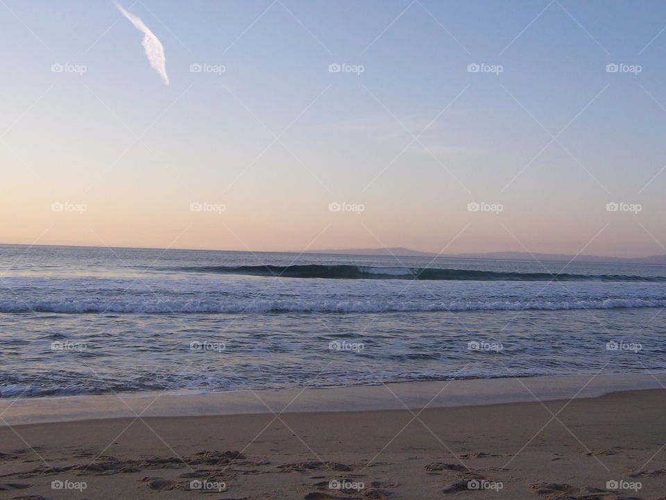 Quill pen cloud. Enjoying the beach after a long hard day of work