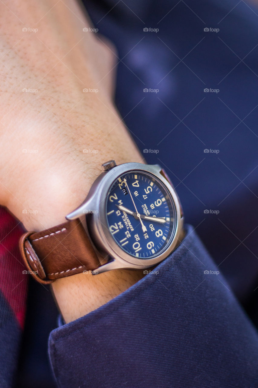Close-up of a watch on the wrist of a model. This is a fashion type of shot.