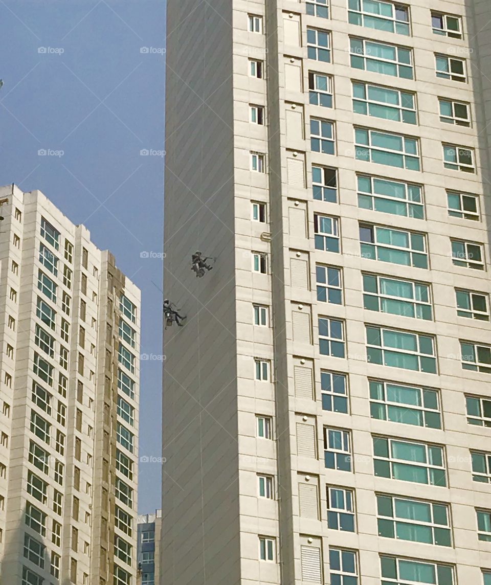 Painting Apartment Building’s Wall