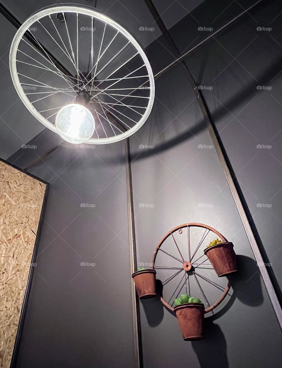 Circle shaped objects made from wheels: flowerpot holder and lamp