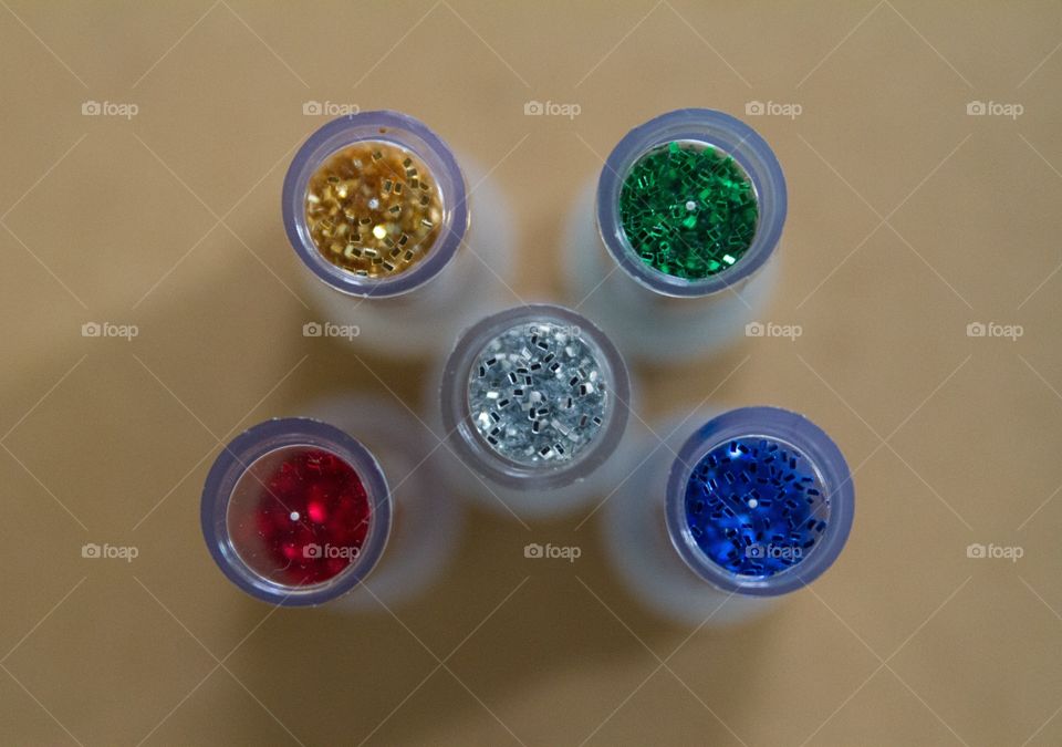 Five tubes of glitter